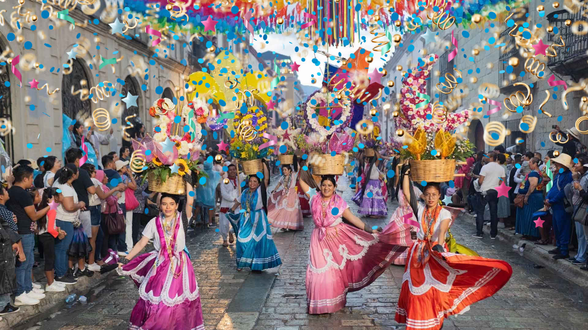 Dancers in traditional Guelaguetza attire parading down the famous Alcalá Street.