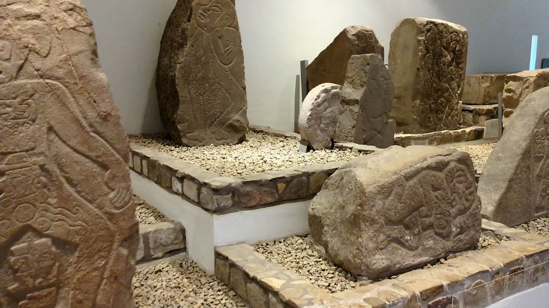 Interior of the Monte Albán Site Museum showing original Danzante Slabs