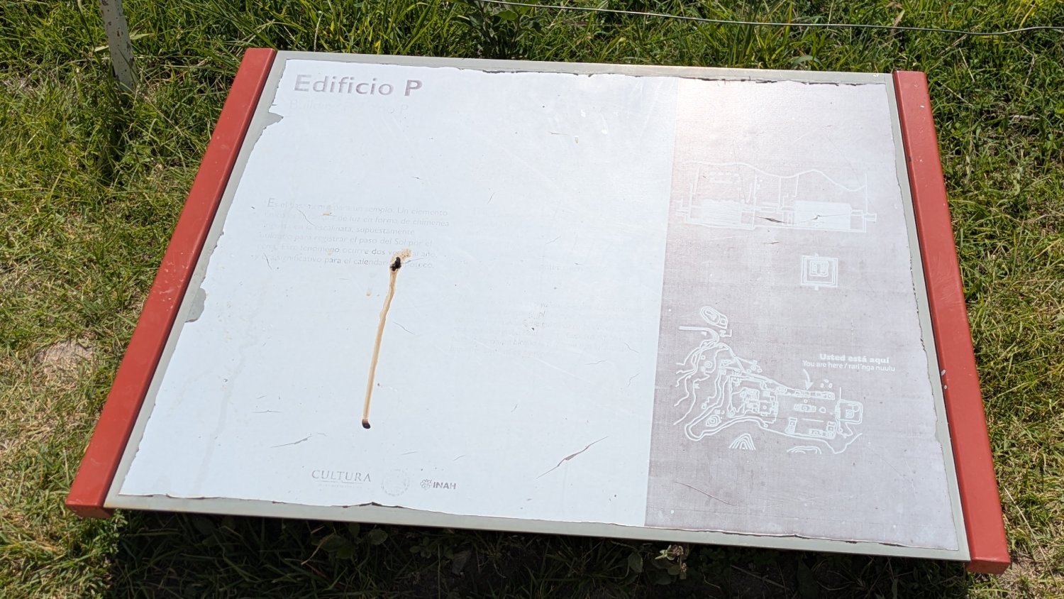 An on-site information panel with almost all of its text faded away